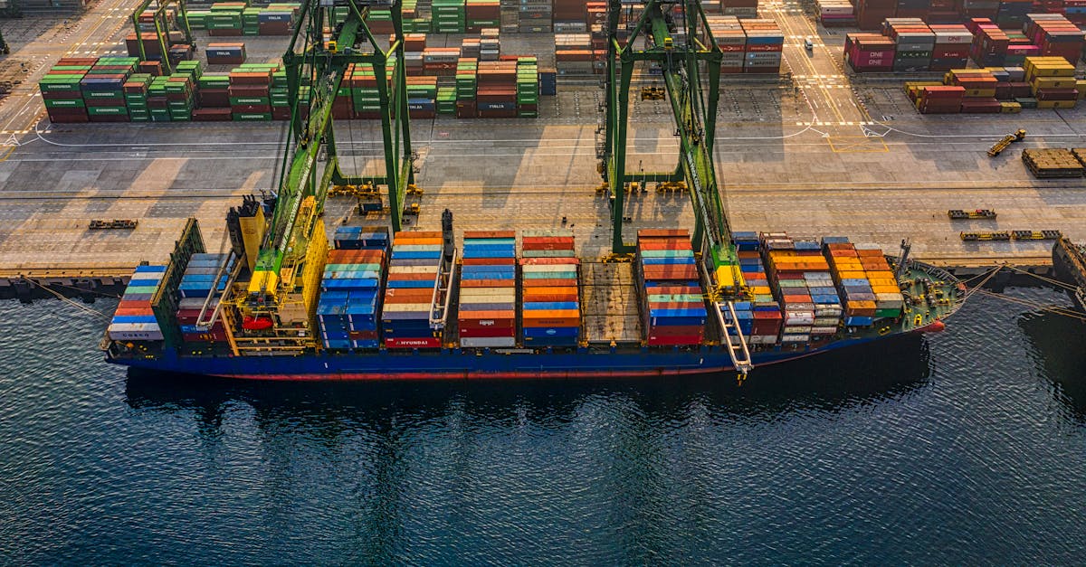 Aerial shot of colorful shipping containers at North Jakarta's bustling port, Indonesia.